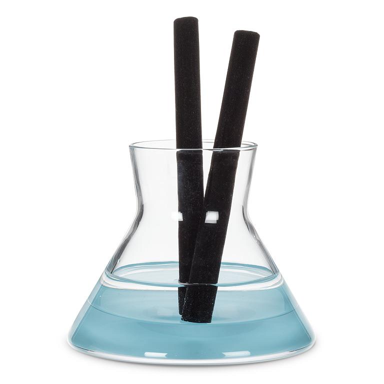 Vivid Sea Island Cotton Modern Diffuser and blue liquid on a white background