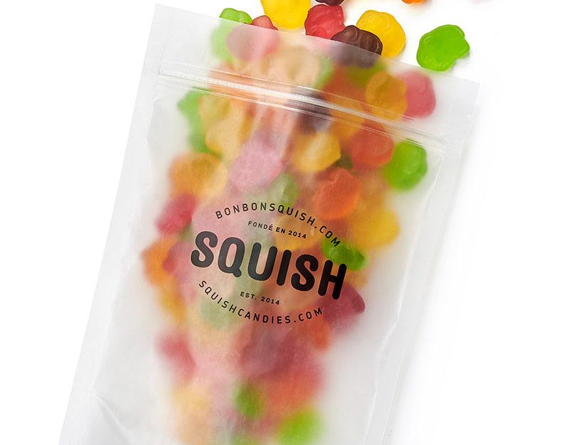 Clear bag of colorful gummy bears with 'Squish' branding on a white background