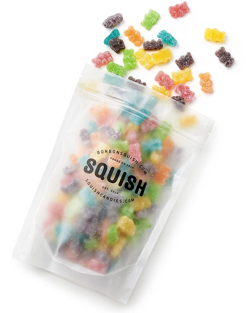 Bag of colorful gummy bears with 'Squish' branding on a white background