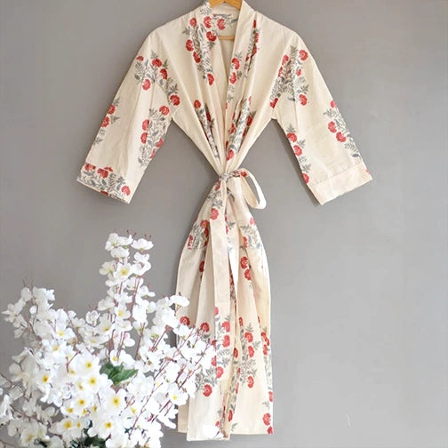 White printed bathrobe hanging with flower vase