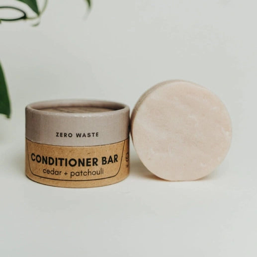 Zero waste conditioner bar with packaging on a white background