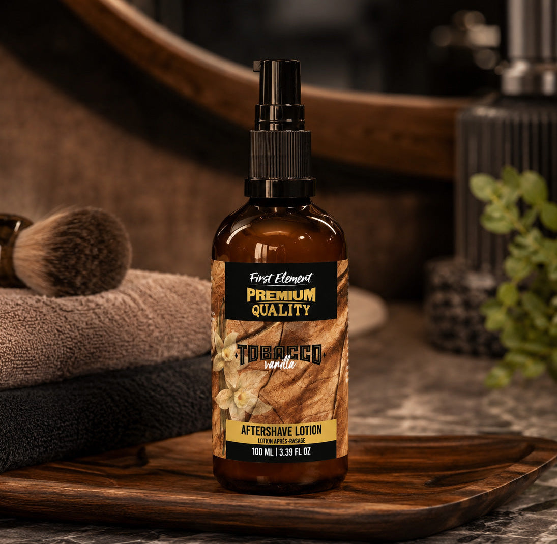 Aftershave lotion bottle labeled 'First Element Premium Quality' on a wooden tray with grooming items in the background.