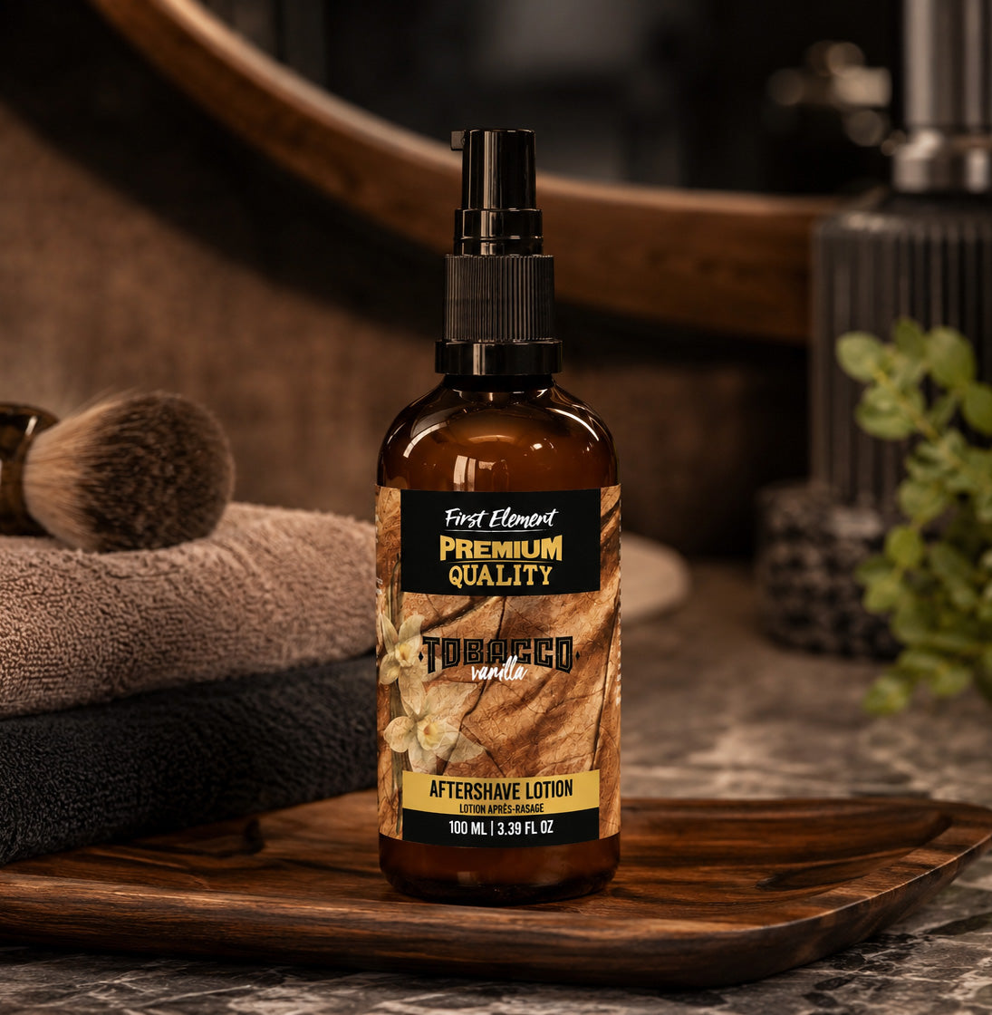 Aftershave lotion bottle labeled 'First Element Premium Quality' on a wooden tray with grooming items in the background.