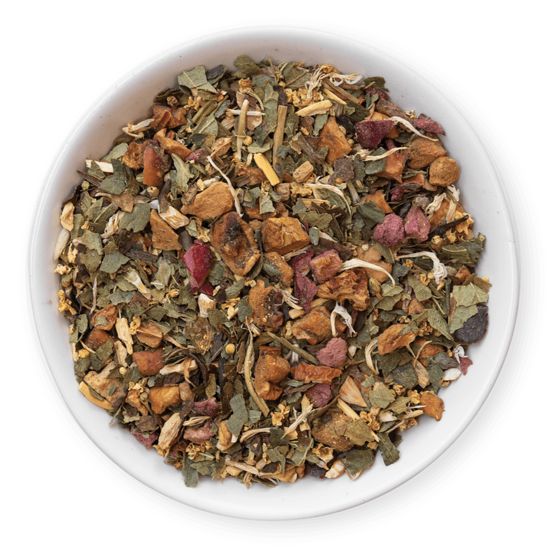 Assorted dried herbs and leaves in a white bowl on a dark background
