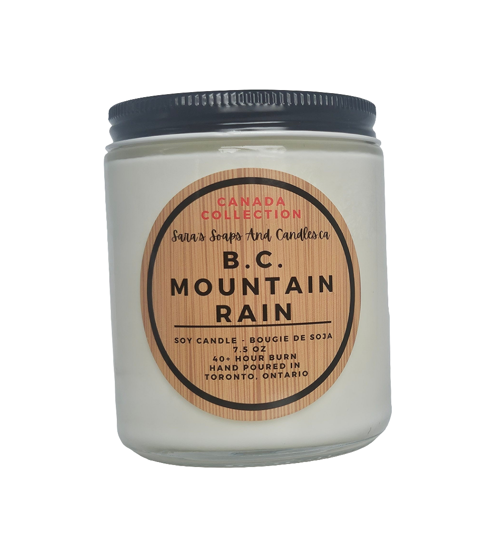 Candle jar labeled 'B.C. Mountain Rain' from Canada Collection on a white background