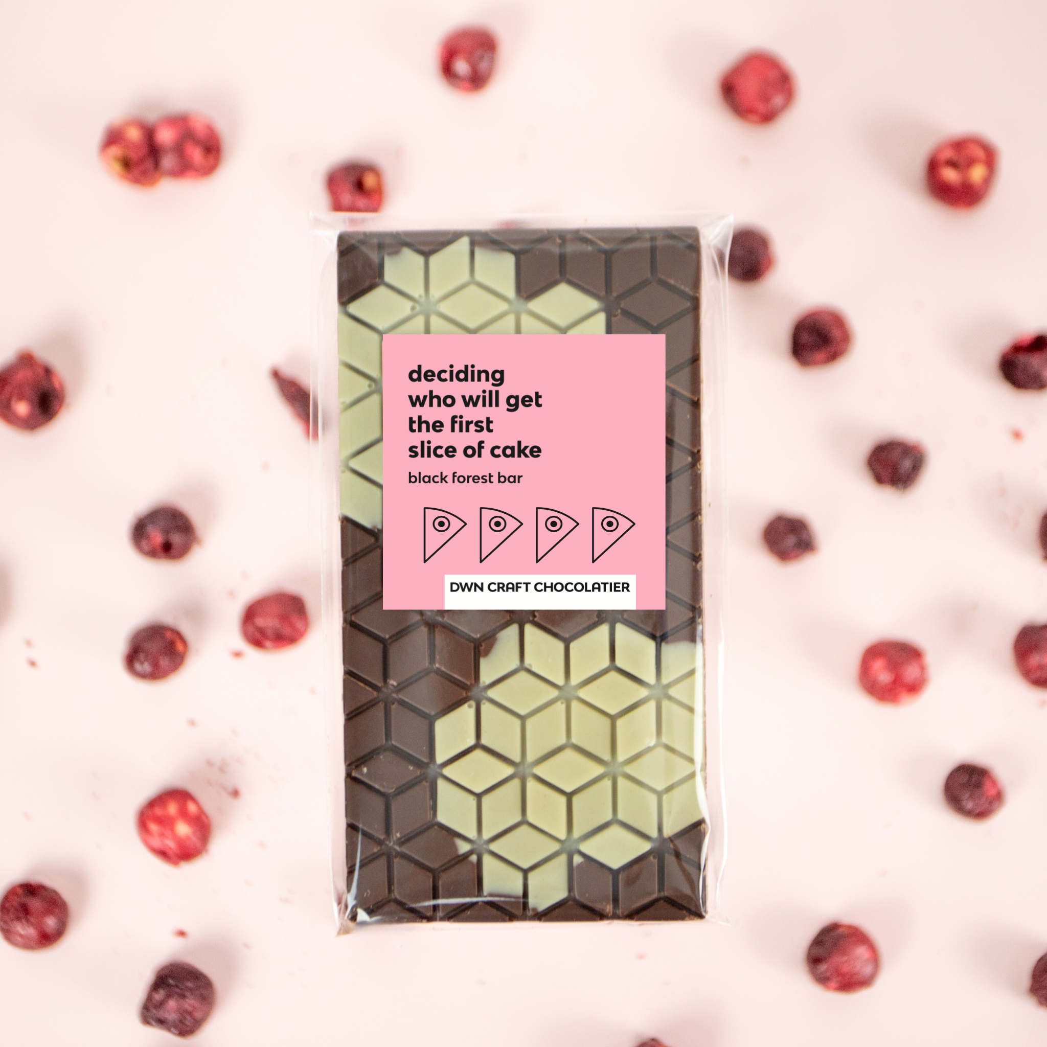 Chocolate bar with a pink label on a white background with red berries
