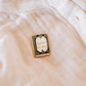 Pin with 'booked all day' text on a light-colored fabric background mimi-and-august