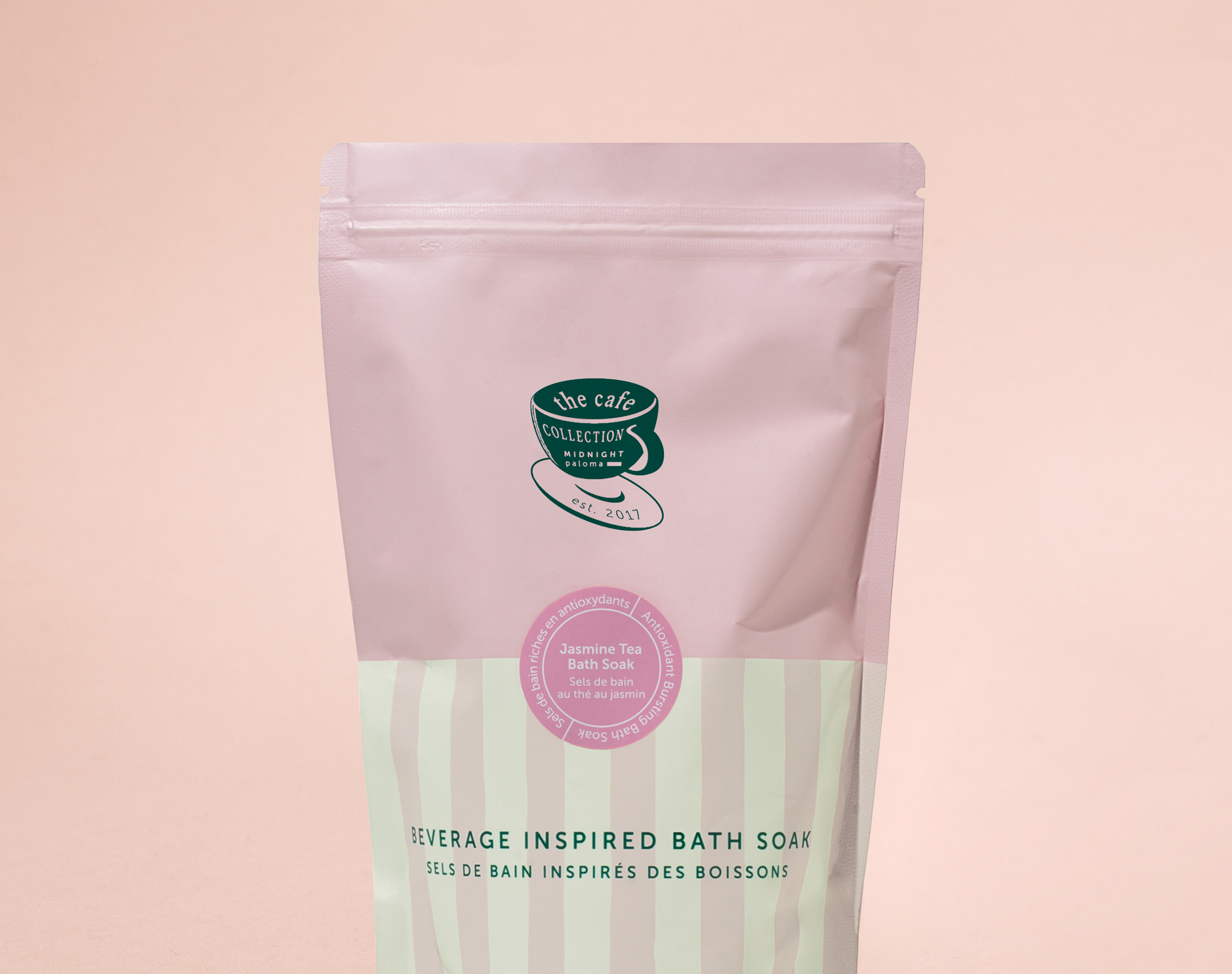 Bath soap package with pink and green design on a pink background