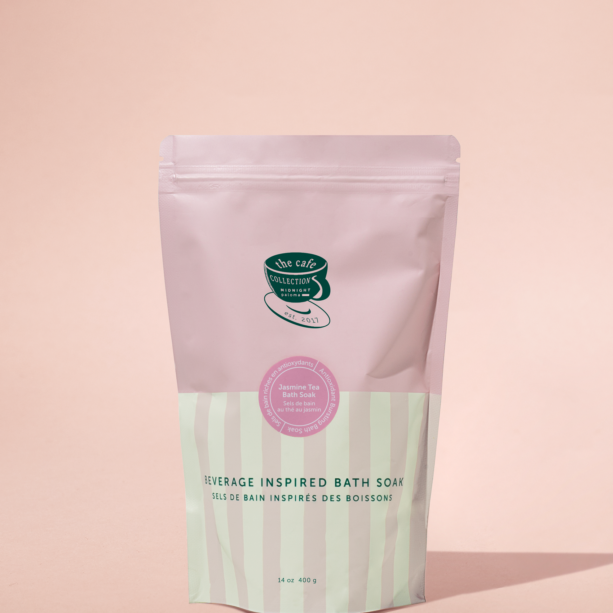 Bath soap package with pink and green design on a pink background