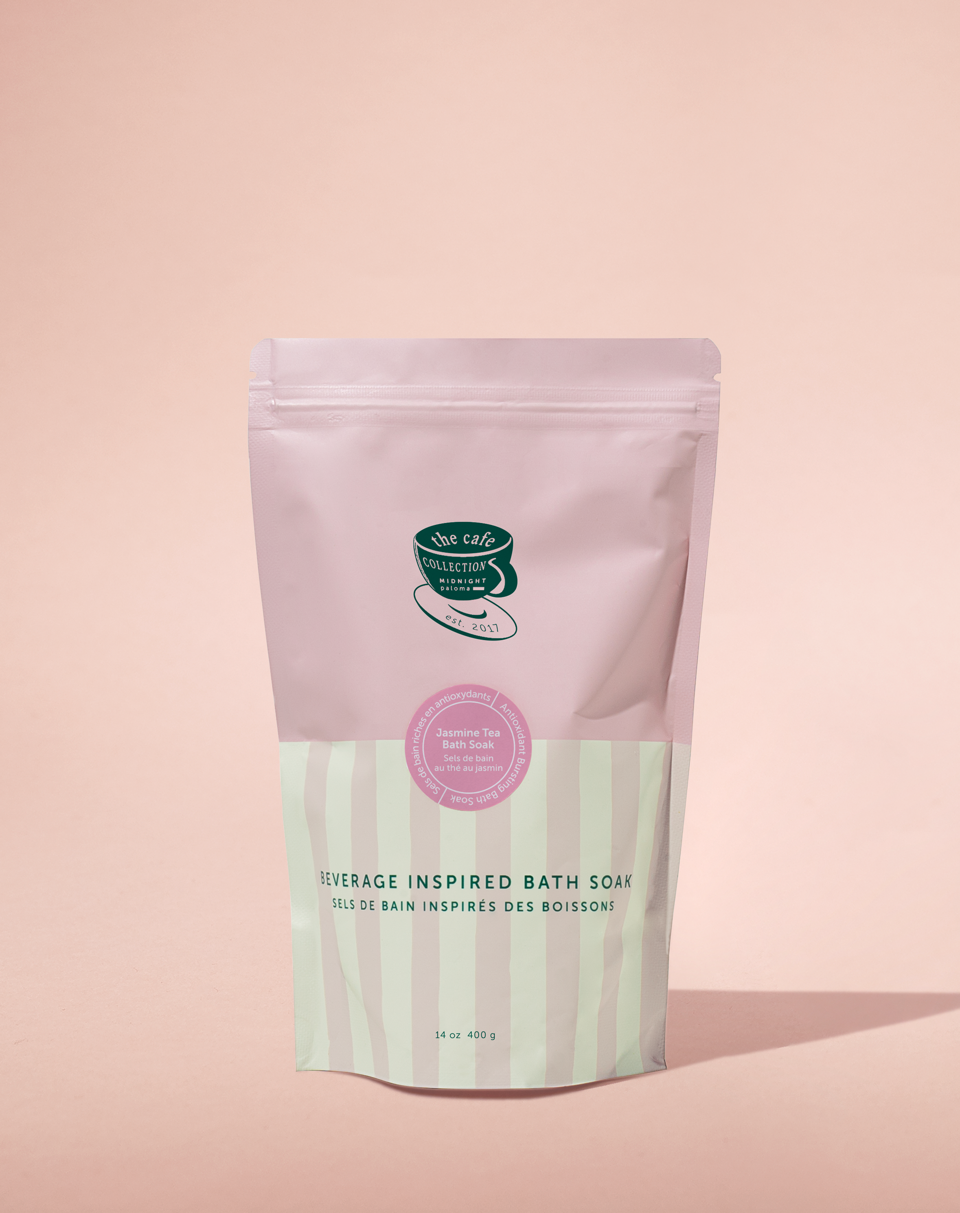 Bath soap package with pink and green design on a pink background