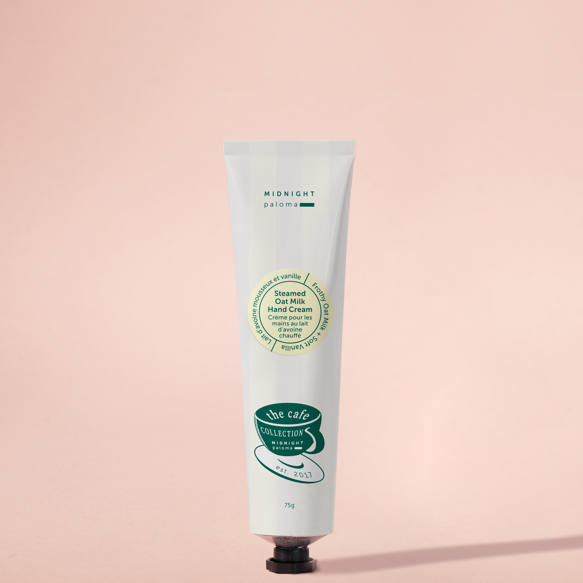 Hand cream tube on a pink background