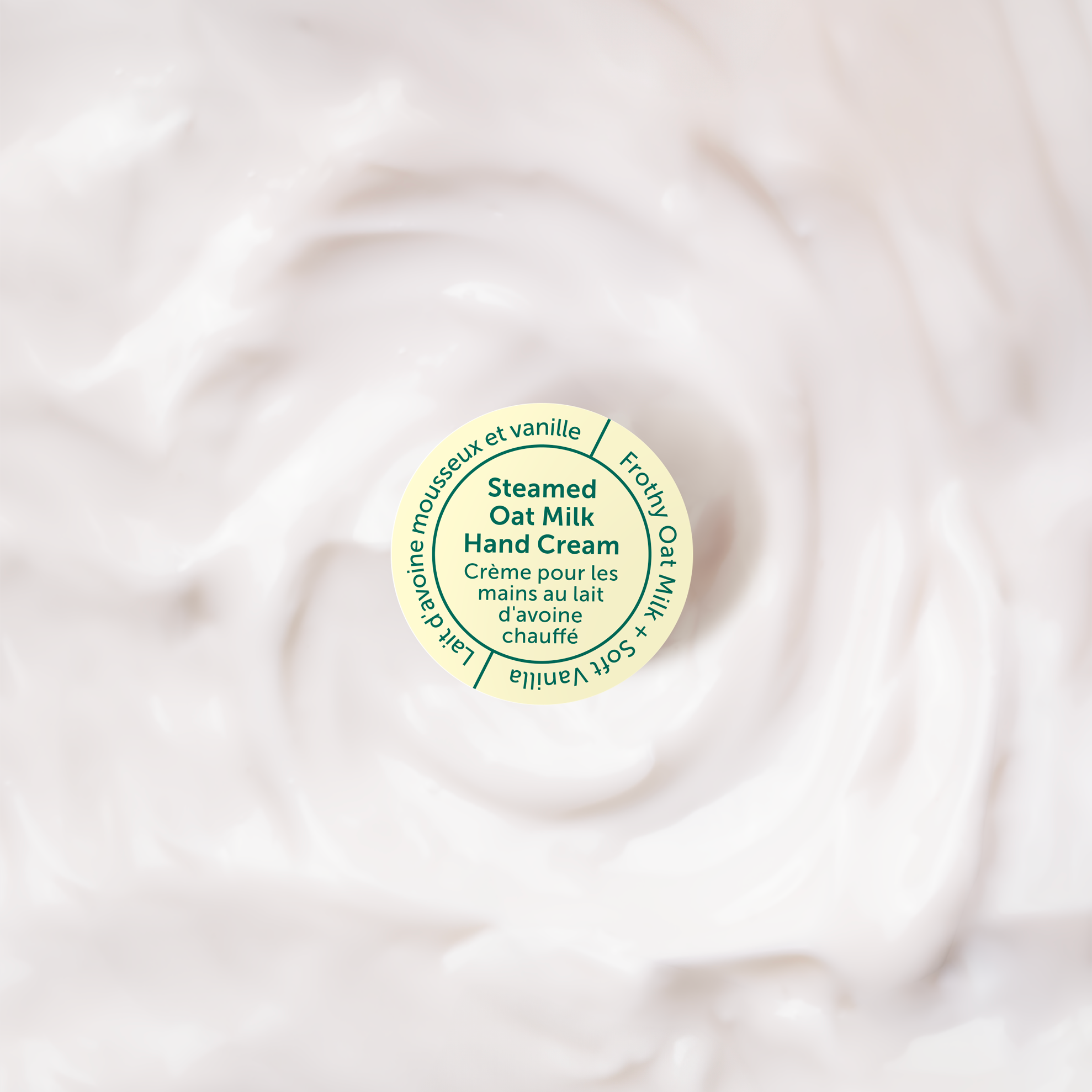 Small container of steamed oat milk jelly cream on a swirling white background