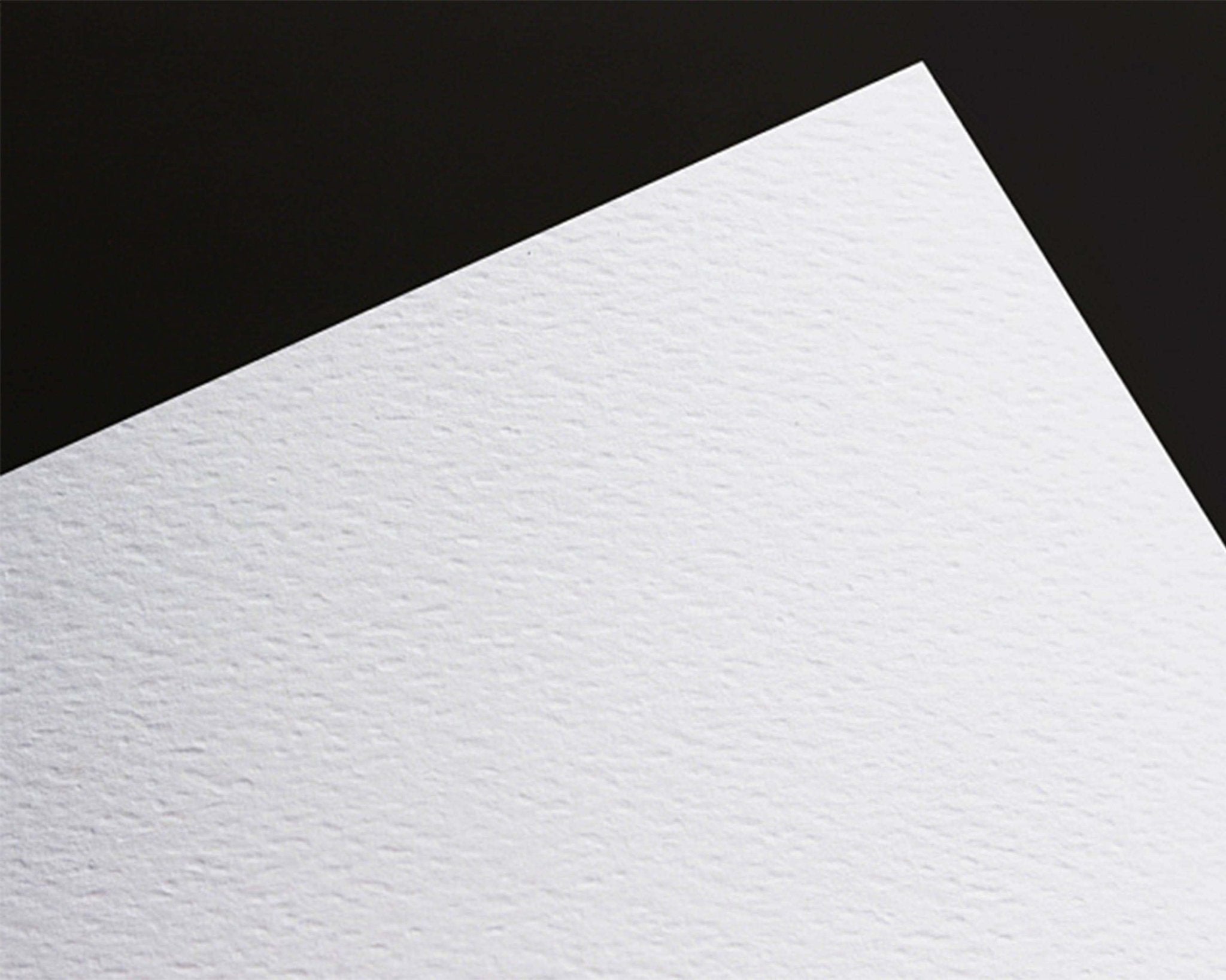 White textured paper sheet on a black background