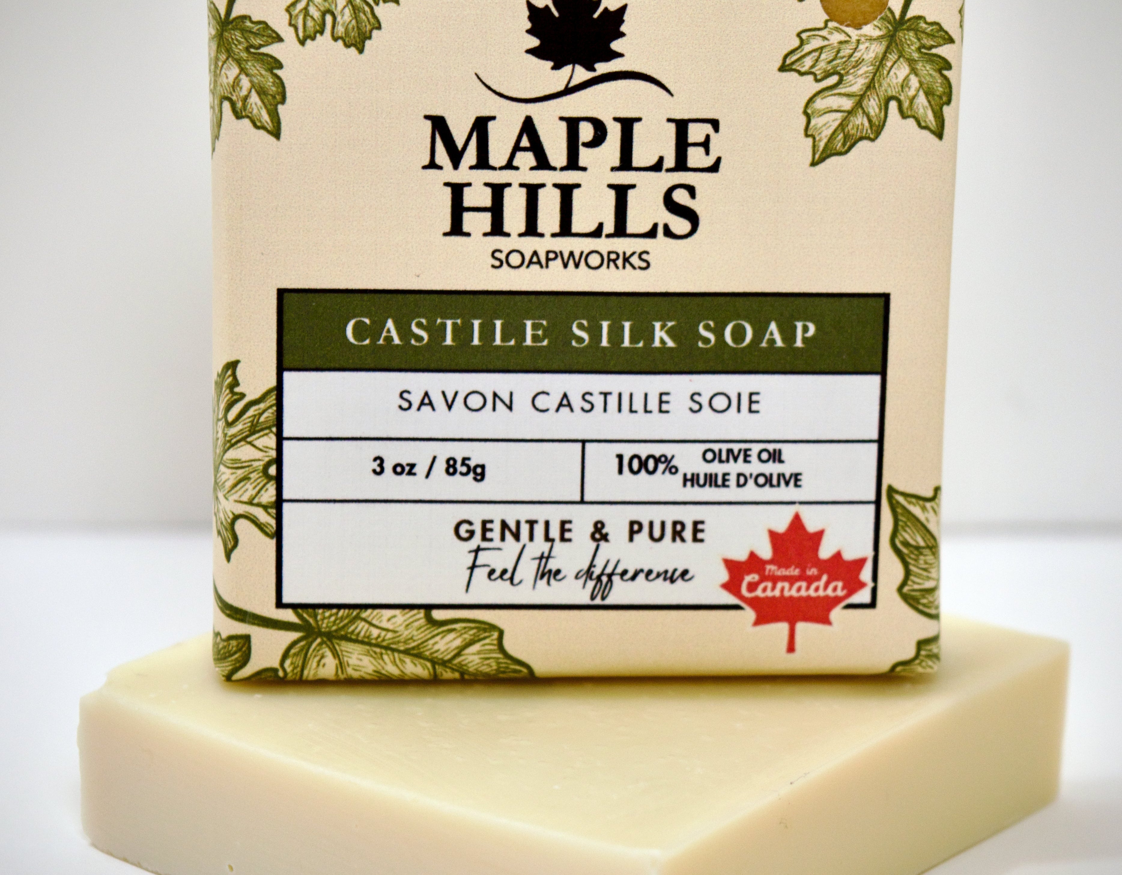 Bar of soap with 'Maple Hills Soapworks' packaging on a white background
