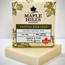 Bar of soap with 'Maple Hills Soapworks' packaging on a white background