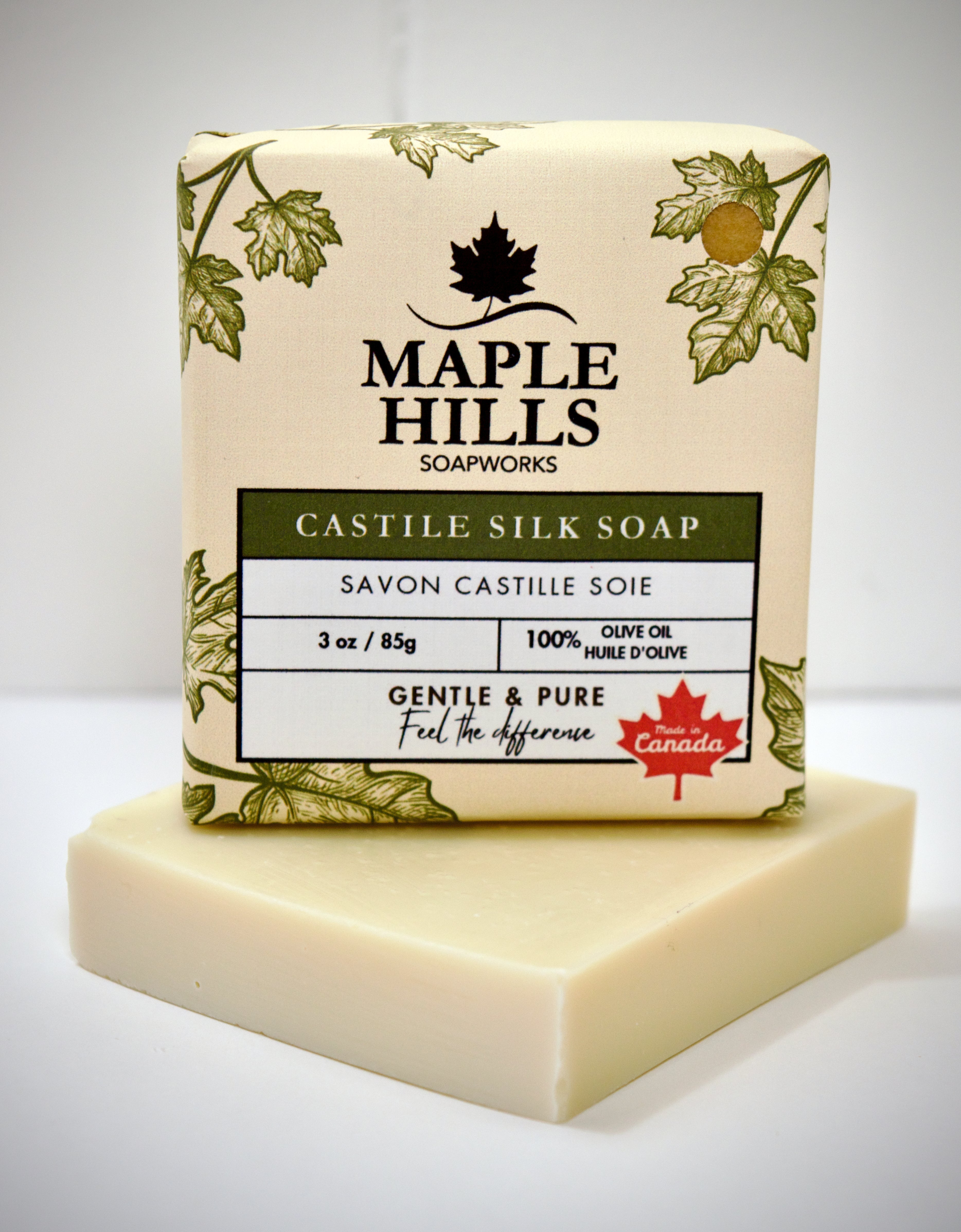 Bar of soap with 'Maple Hills Soapworks' packaging on a white background