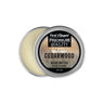 An open round metal tin of First Element Cedarwood Beard Butter, showing the pale cream-colored balm inside and a label with a woodgrain pattern on a white background.