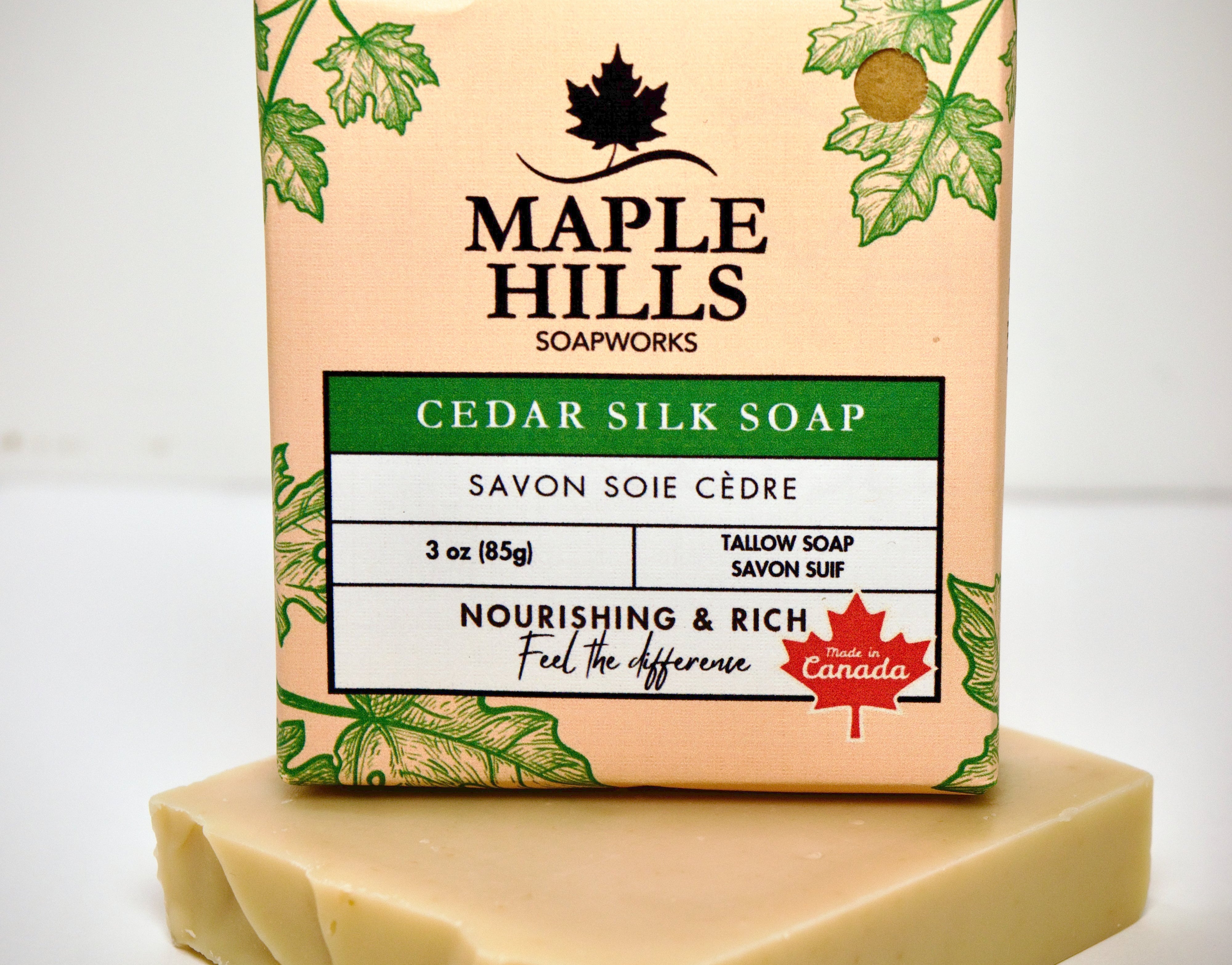 Bar of soap with Maple Hills Soapworks packaging on a white background