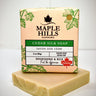 Bar of soap with Maple Hills Soapworks packaging on a white background