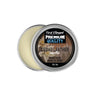 An open round metal tin of First Element Premium Quality Beard Balm in Cedar Leather vanilla scent, showing the pale cream balm inside next to the lid label.