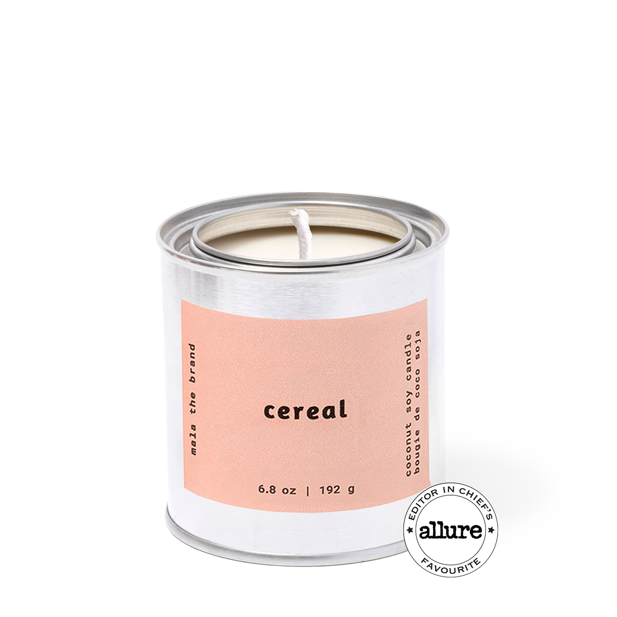 Candle in a metal container with a pink label on a white background