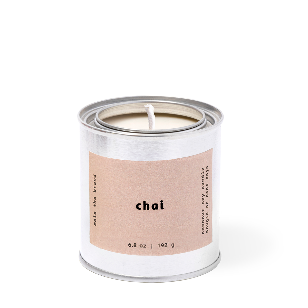 Candle in a metal container with 'chai' label on a white background
