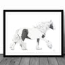 Framed black and white drawing of a horse on a wooden floor with a white wall background