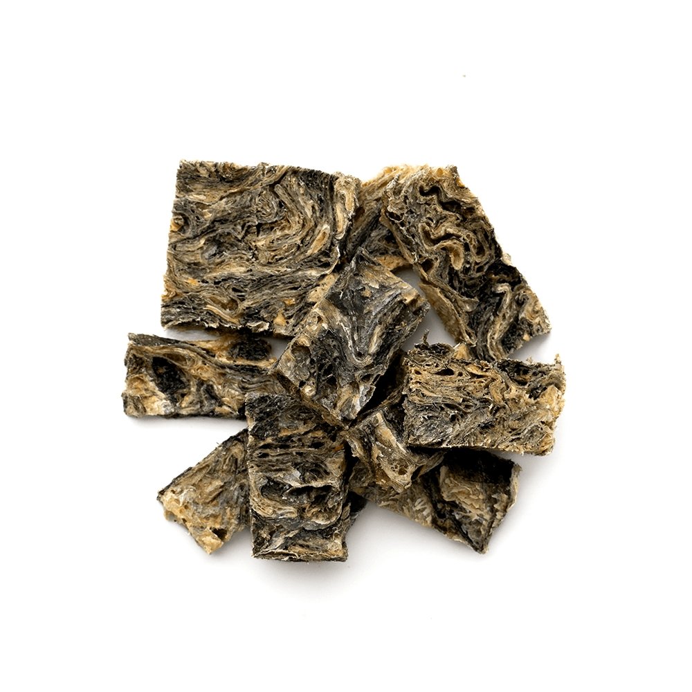 Dried tea leaves on a white background