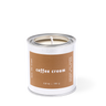 Candle in a white container with a brown label on a white background