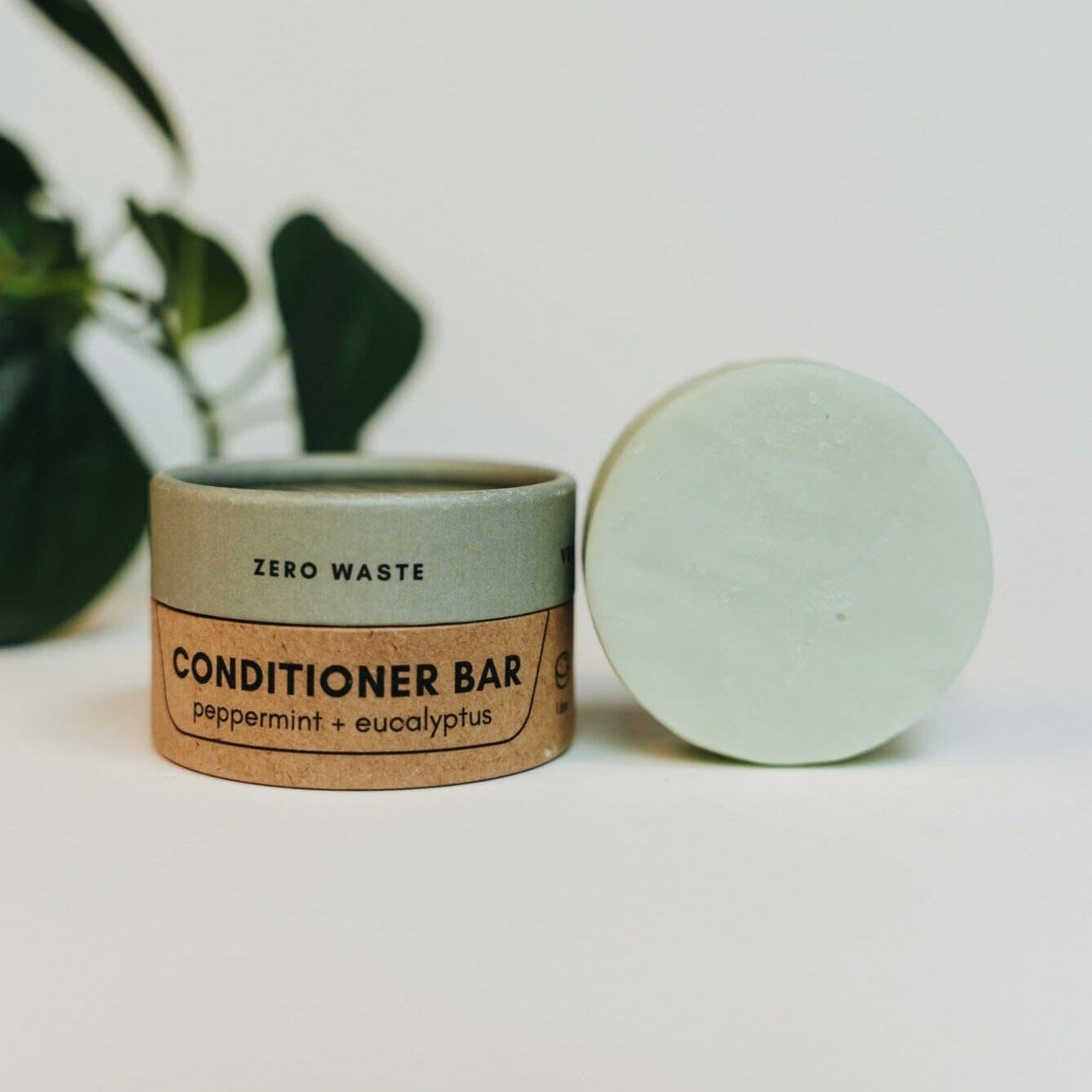 Zero waste conditioner bar with packaging on a light background