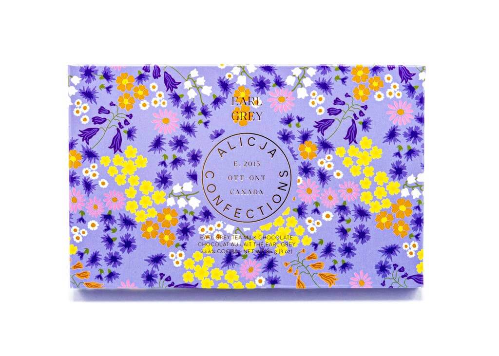 Earl Grey Milk Chocolate Bar packaging design featuring floral patterns and vibrant colors, 33.6% cocoa.