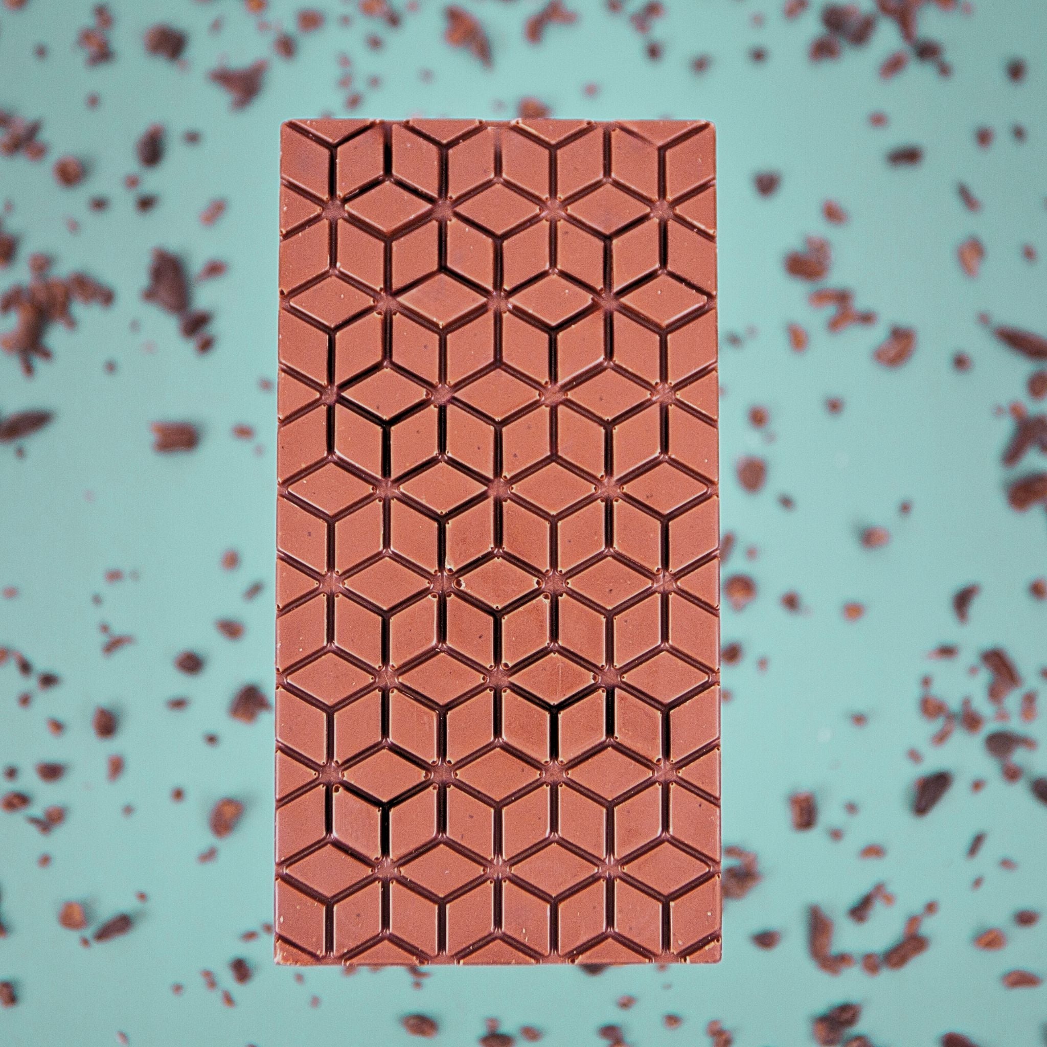 Chocolate bar with geometric pattern on a light blue background