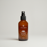 LISA NOTO Toning Floral Water Brown bottle with black spray nozzle on a light grey background