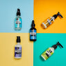 Four skincare bottles on a colorful geometric background