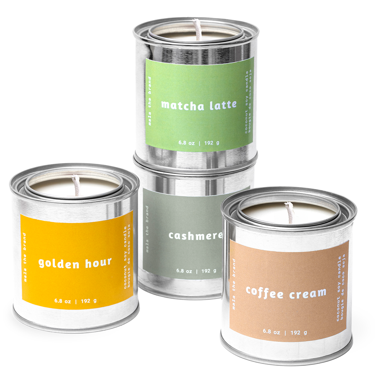 Three candles in metal cans with labels on a white background