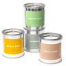 Three candles in metal cans with labels on a white background