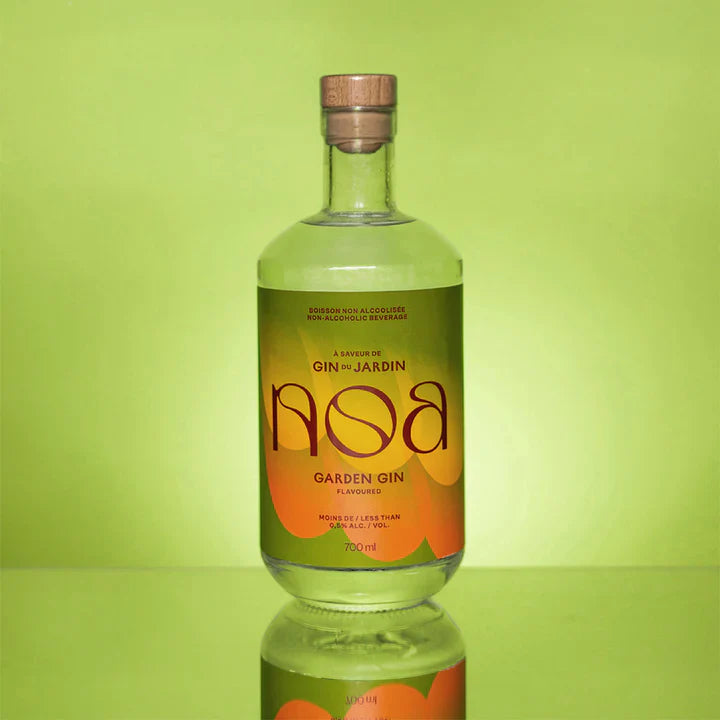 Bottle of Gin du Jardin Aosa Garden Gin on a green background
