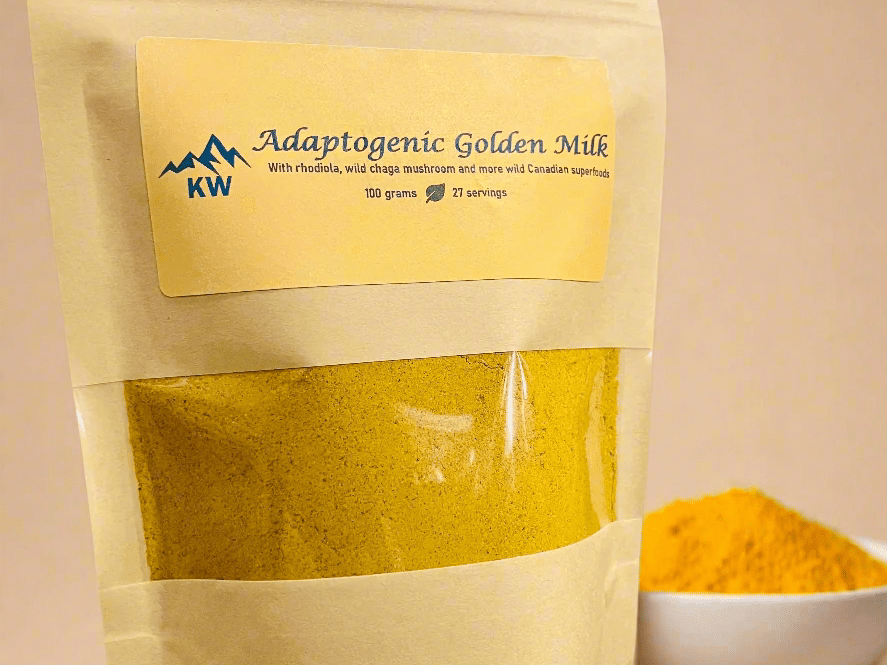 Package of Adaptogenic Golden Milk with a bowl of turmeric powder on a beige background