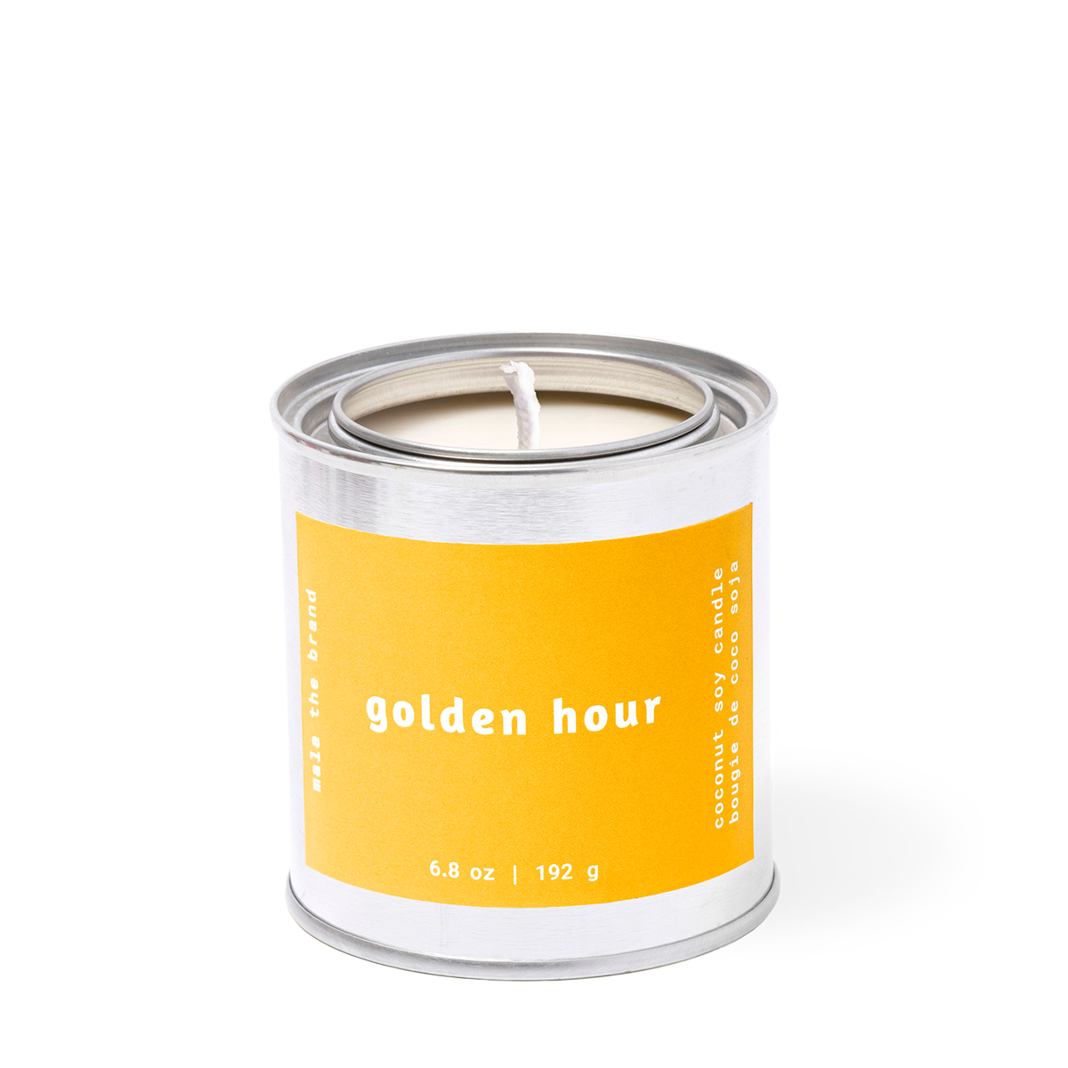 Candle in a metal can with a yellow label on a white background