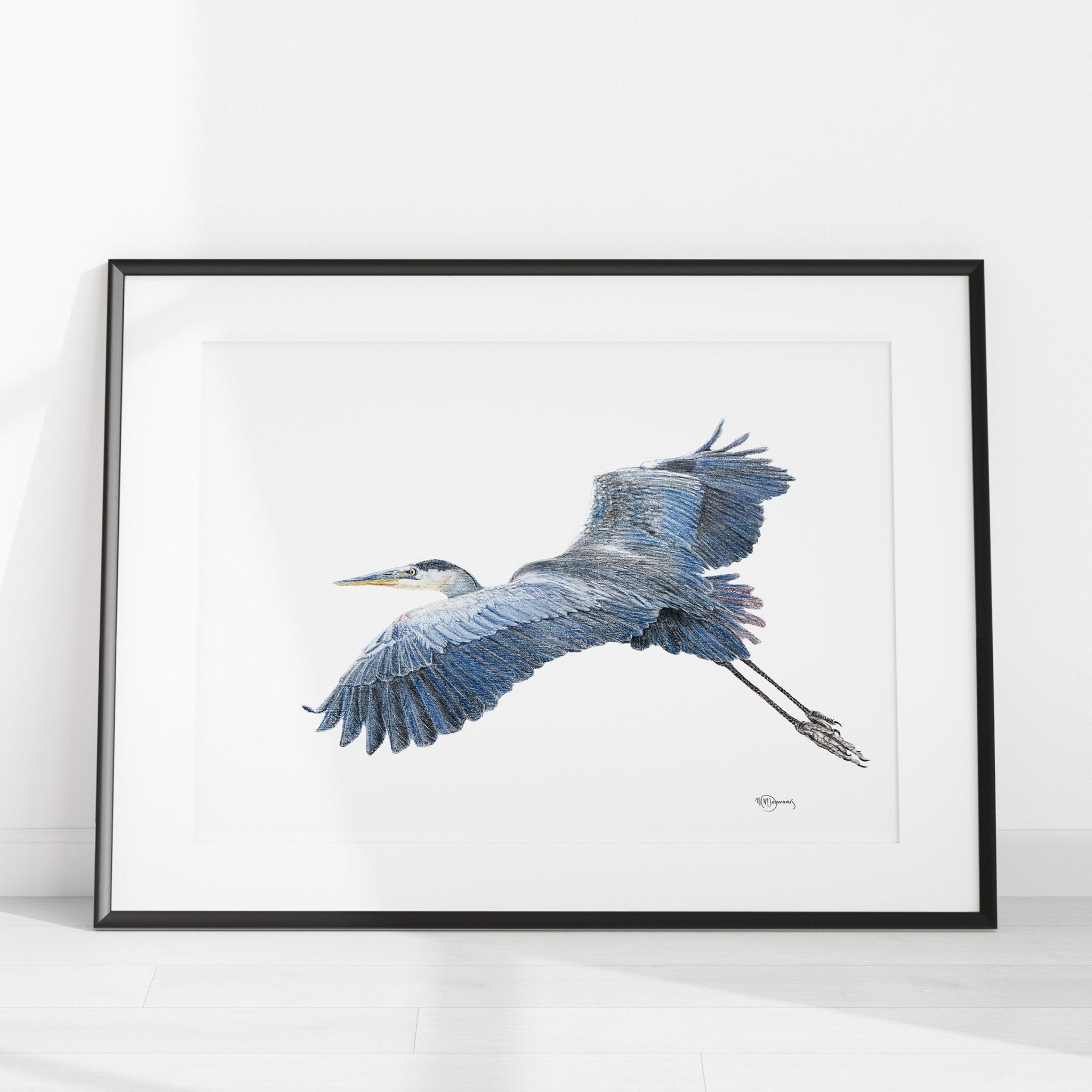 Framed artwork of a heron in flight on a white background