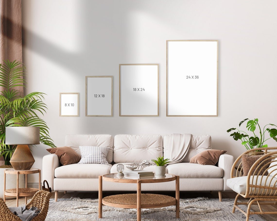 Living room with a beige sofa, wicker coffee table, and framed pictures on the wall.