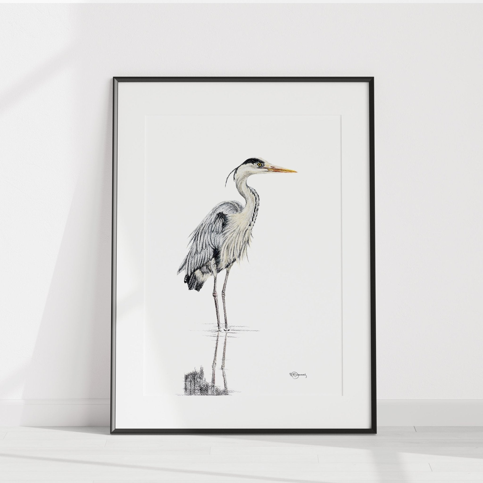 Framed artwork of a heron on a white background