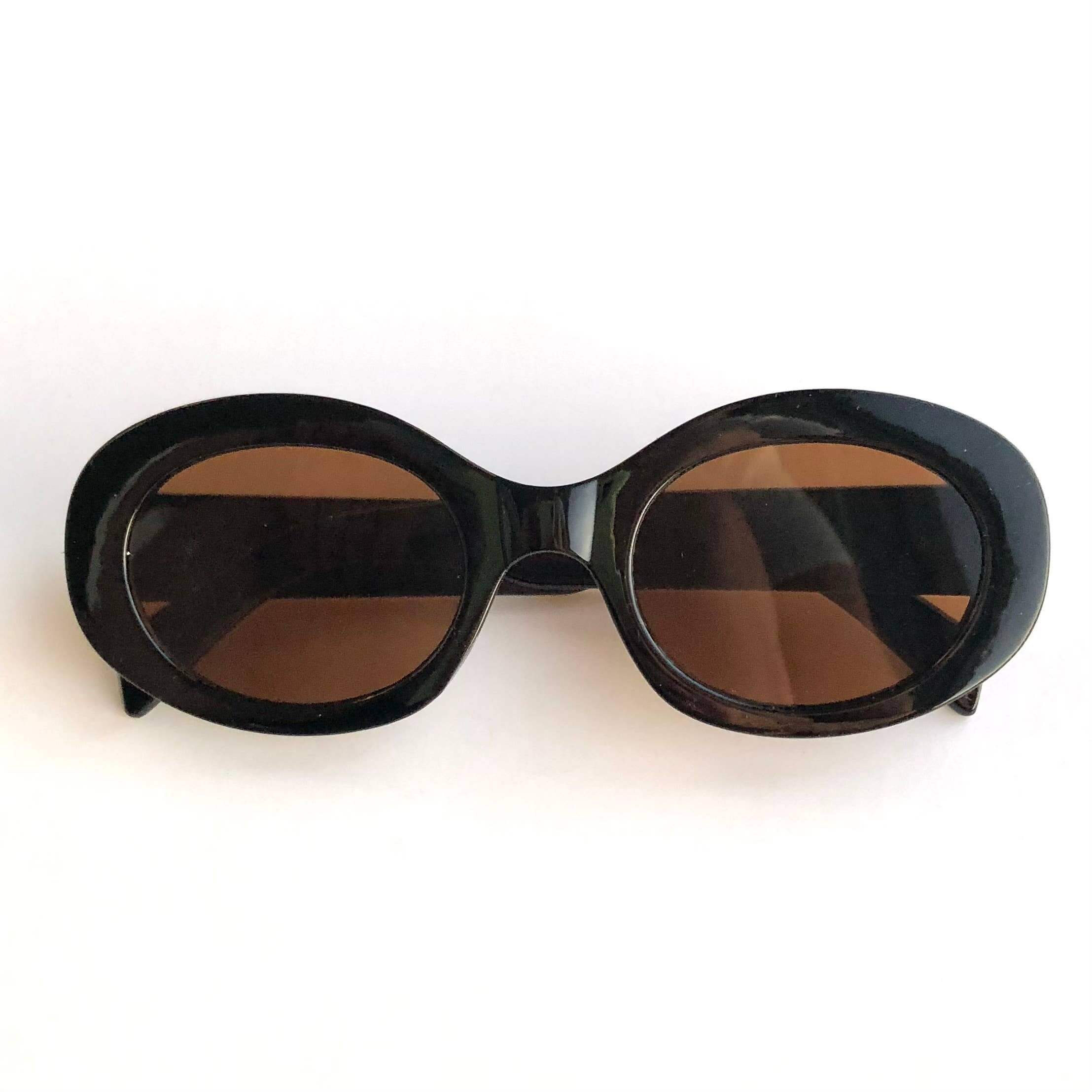 iconic mi Adult Fashion Sunglasses Oval With Gold Accent: Black/brown lense