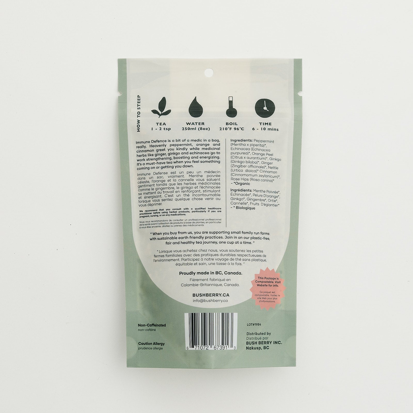 Back view of a green tea package with text and icons on a white background