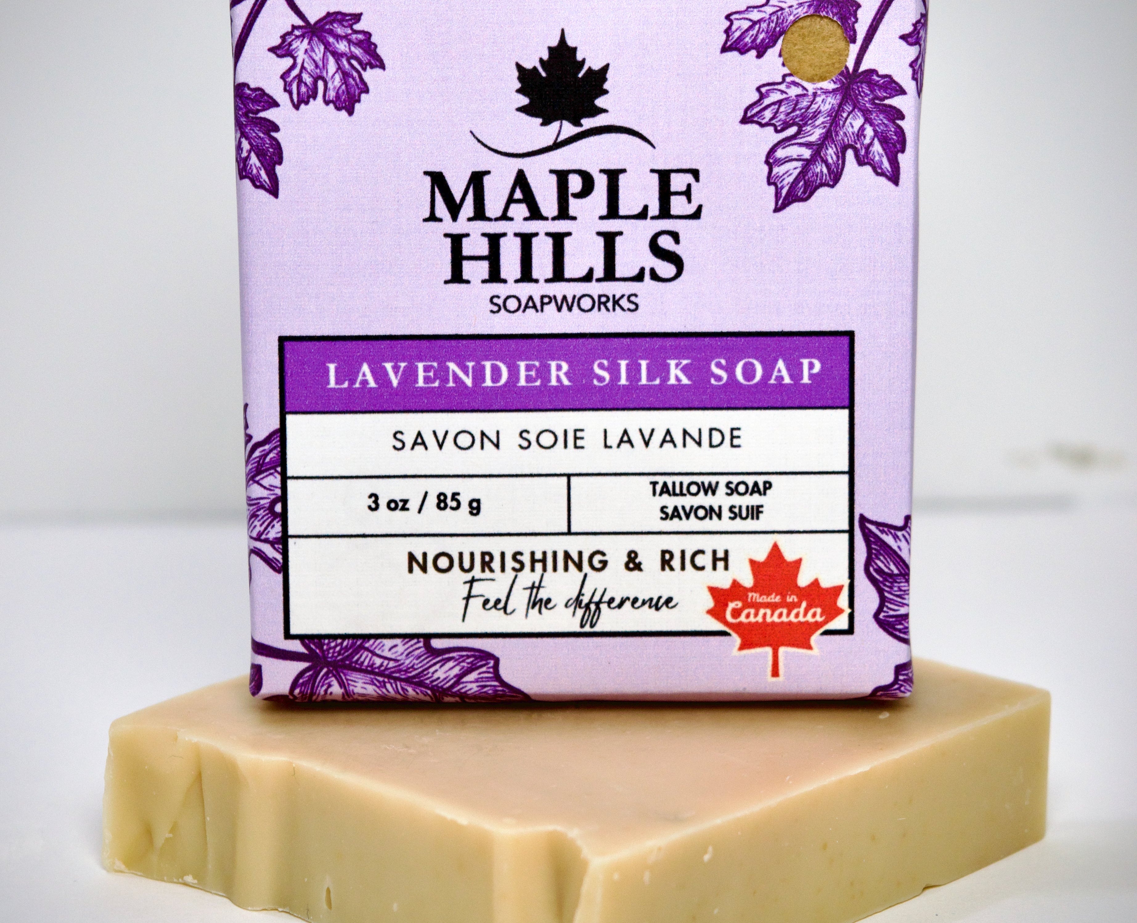 Bar of soap with a purple Maple Hills Soapworks packaging on a white background
