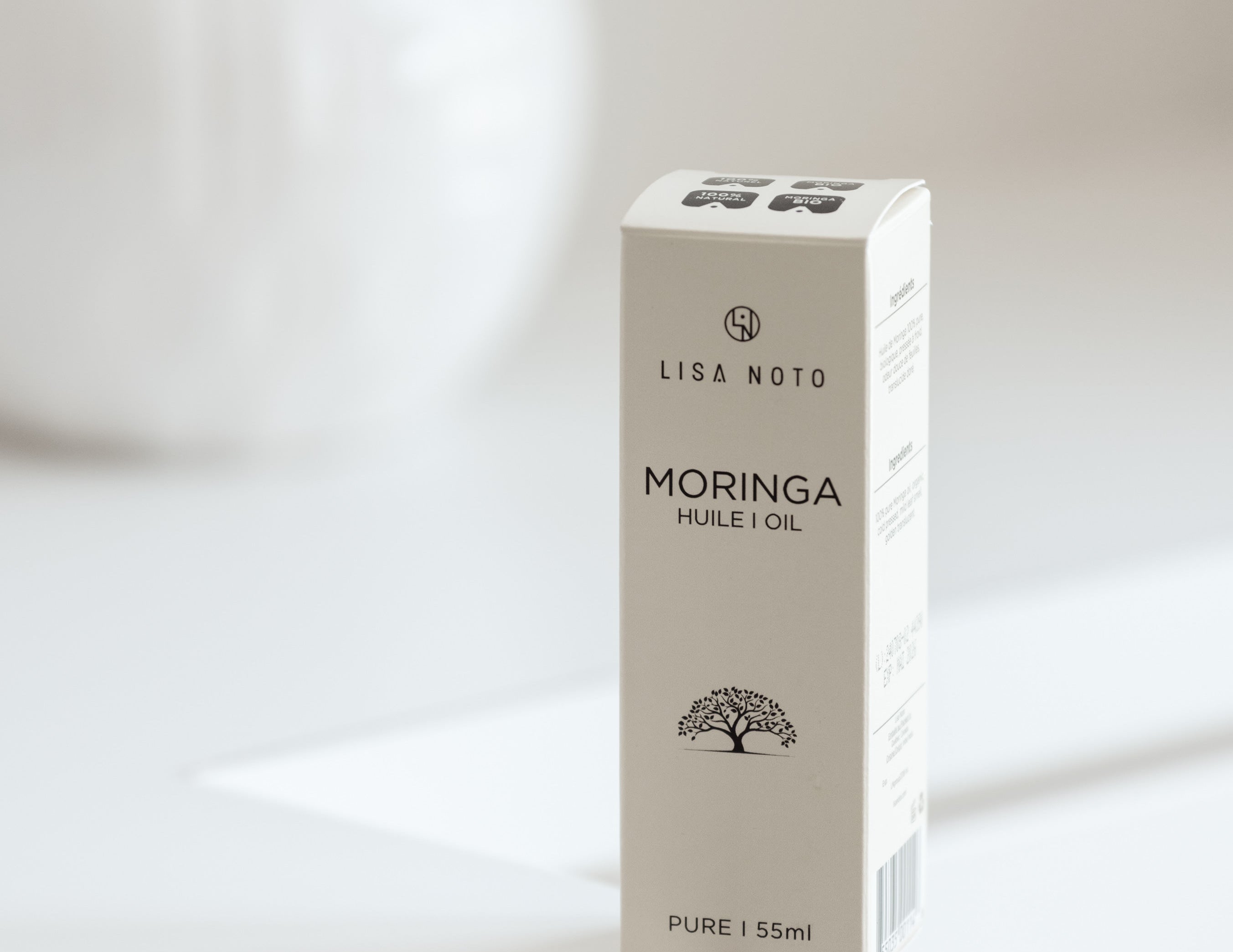 Box of Lisa Noto Moringa oil on a white background