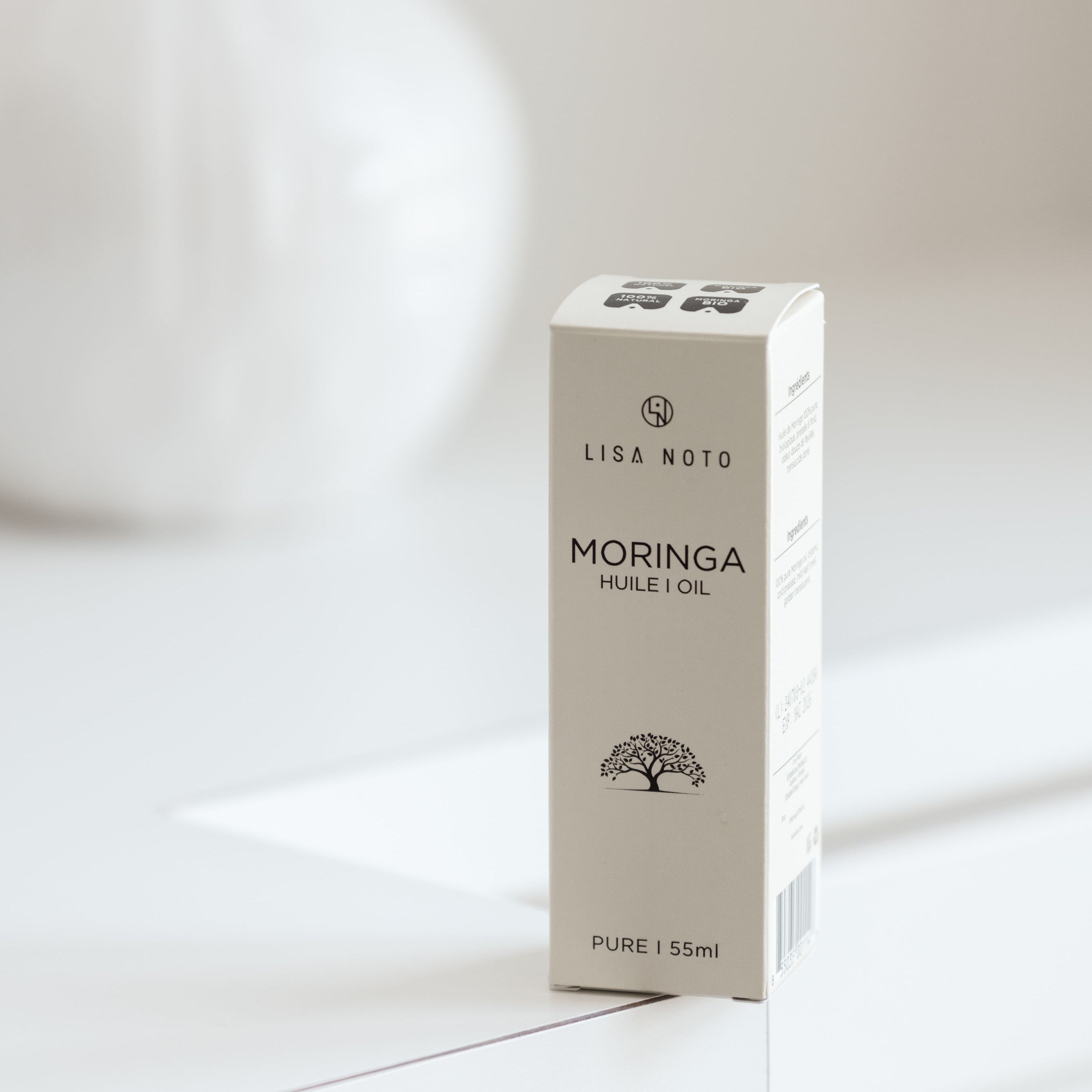 Box of Lisa Noto Moringa oil on a white background