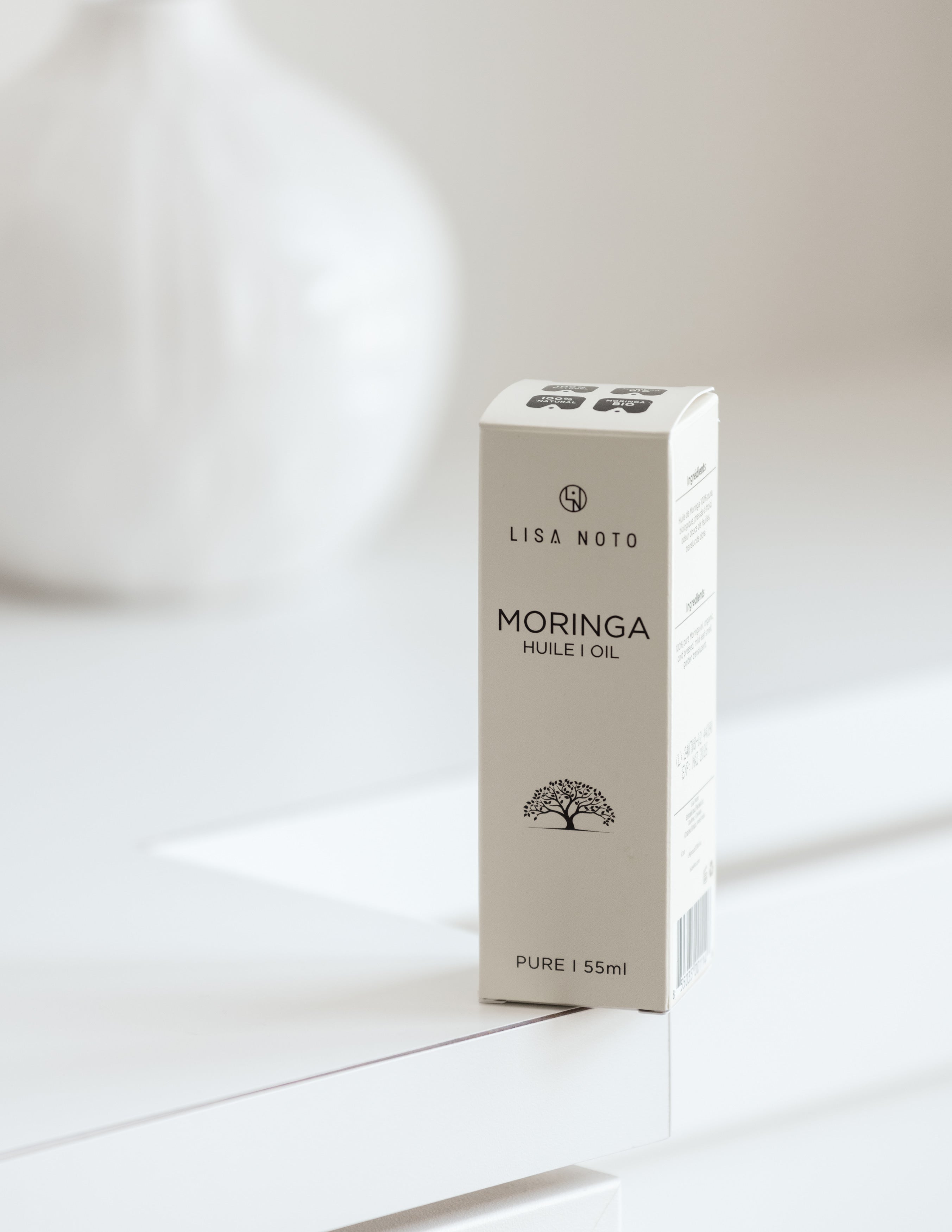 Box of Lisa Noto Moringa oil on a white background