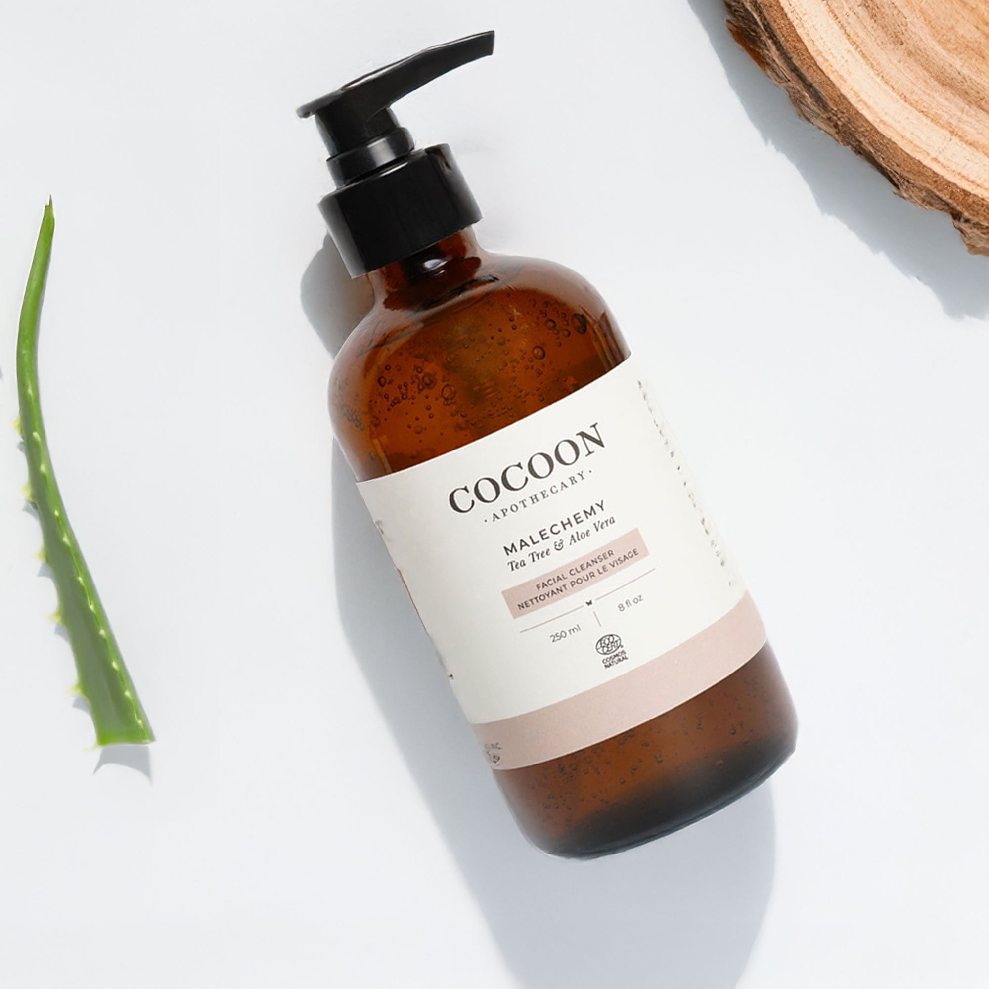 Brown bottle with pump and 'Cocoon' label on a light background