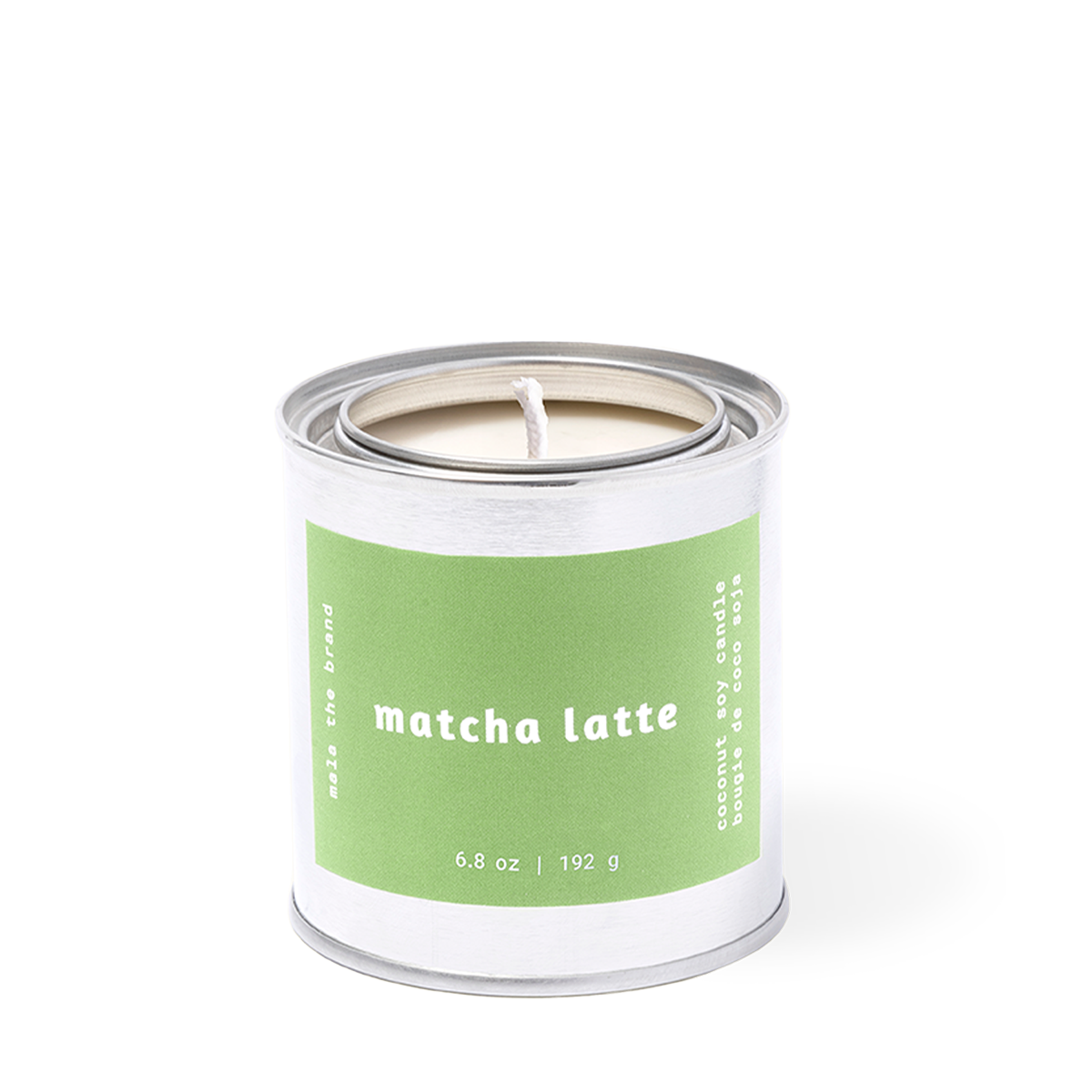 Candle in a metal container with a green label on a white background
